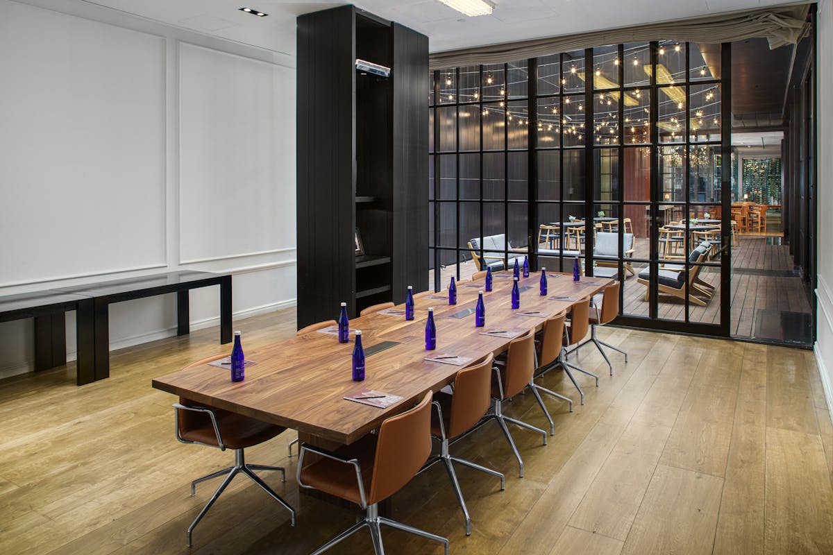 a row of wooden benches sitting on top of a table